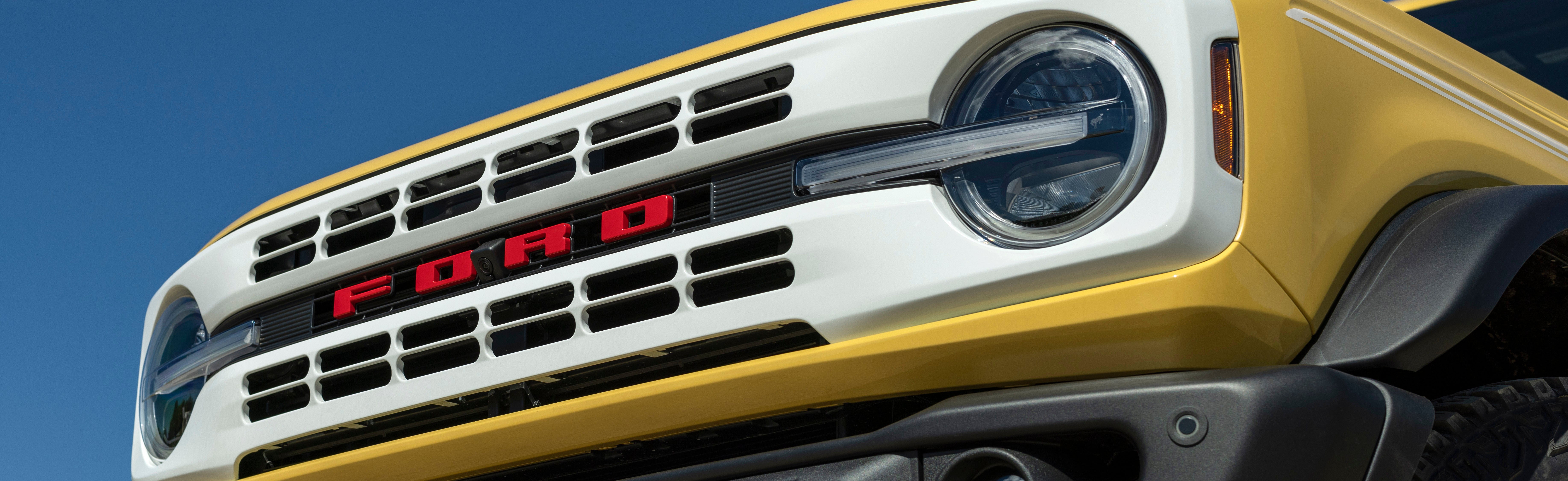 A Ford F-150 Lightning highlighting its convenient charging process as it replenishes its battery at a home charging station.