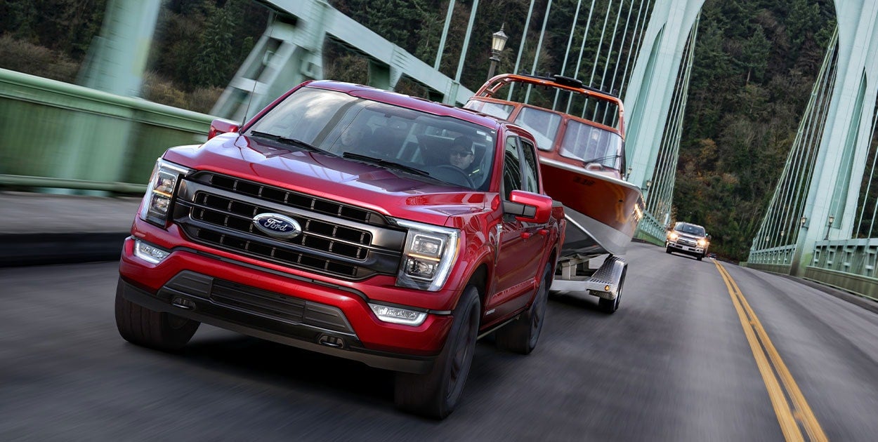 A Ford Bronco Sport highlighting its spacious cargo area and comfortable interior while parked at a scenic mountain vista.