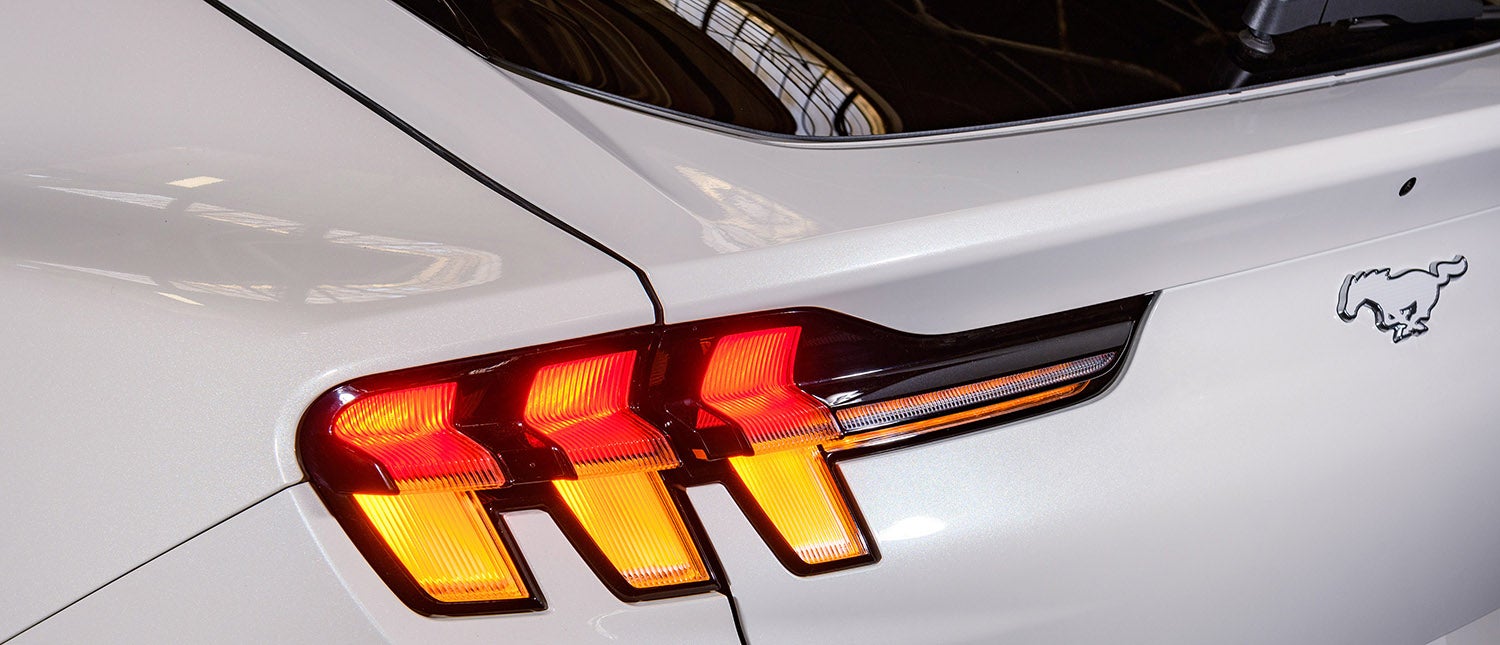 A Ford Explorer towing a trailer on a highway.